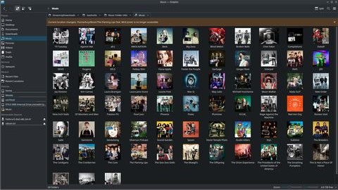 Dolphin file manager showing music folder with album art icons
